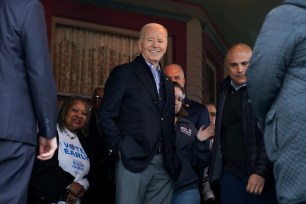 President Joe Biden meets supporters and volunteers during a campaign event at a home in Saginaw, Michigan.