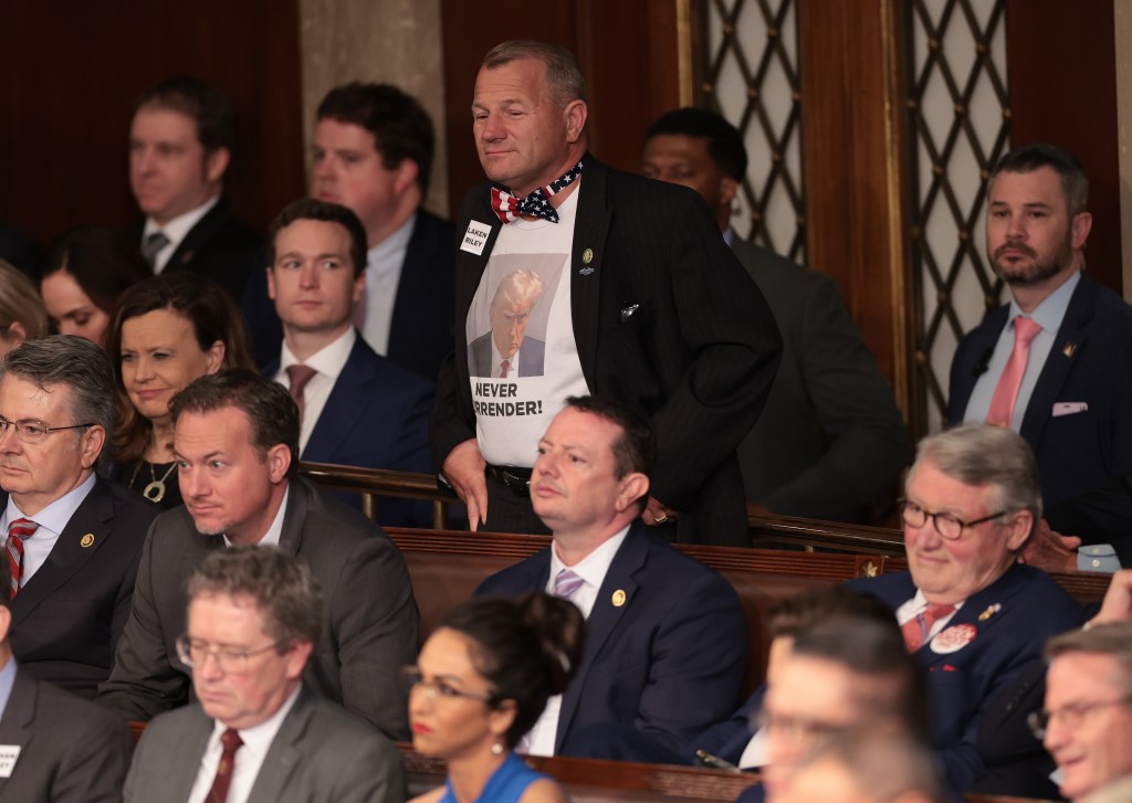 U.S. Rep. Troy Nehls (R-TX) wears a Donald Trump themed shirt during President Joe Biden's State of the Union address.