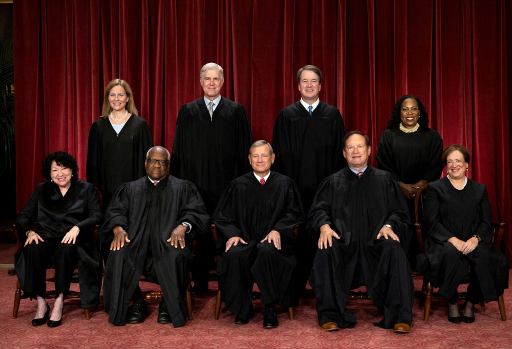 Supreme Court justices Amy Coney Barrett, Neil M. Gorsuch, Brett M. Kavanaugh, Ketanji Brown Jackson, Sonia Sotomayor, Clarence Thomas, Chief Justice John G. Roberts, Jr., Samuel A. Alito, Jr. and Elena Kagan pose for their group portrait at the Supreme Court in Washington, U.S., October 7, 2022.