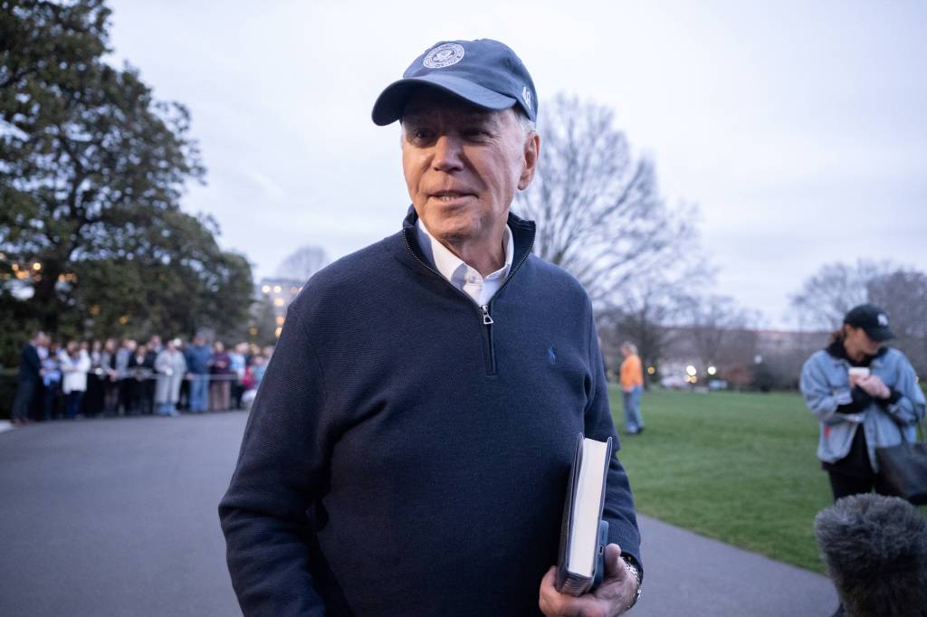 President Joe Biden speaks to the press before he departs the White House in Washington, DC, for the presidential retreat in Camp David, Maryland, on March 1, 2024.