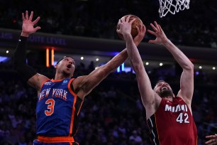 Josh Hart of the New York Knicks vies for a rebound against Kevin Love of the Miami Heat during their basketball game at Madison Square Garden.