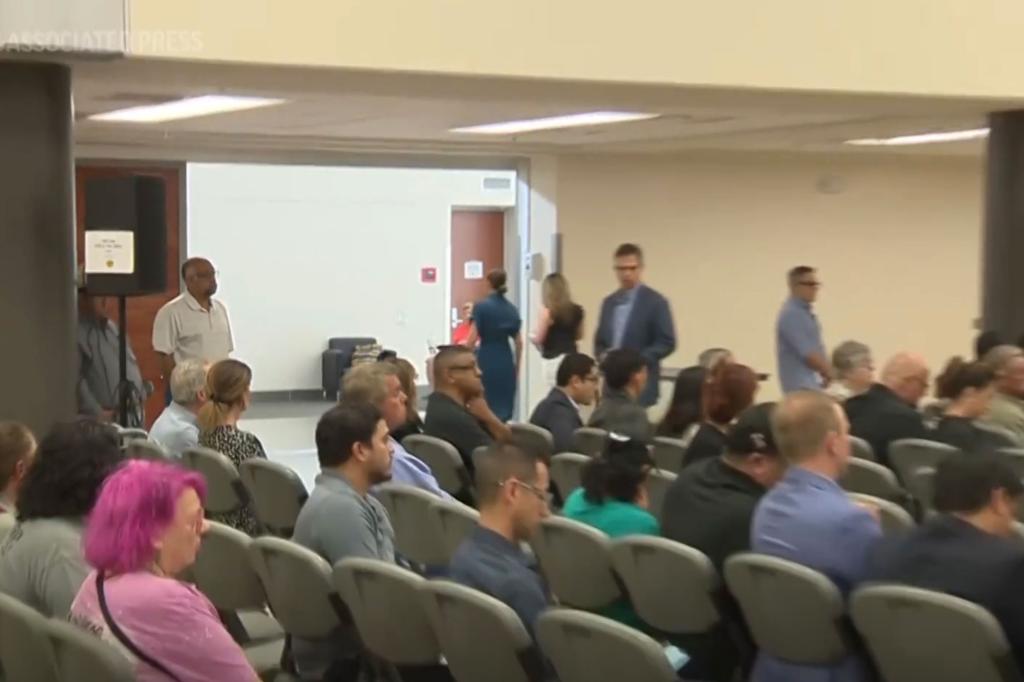 People sit in audience in meeting room 