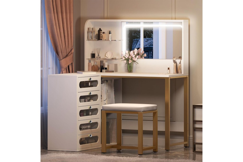 A makeup table with a mirror and a stool