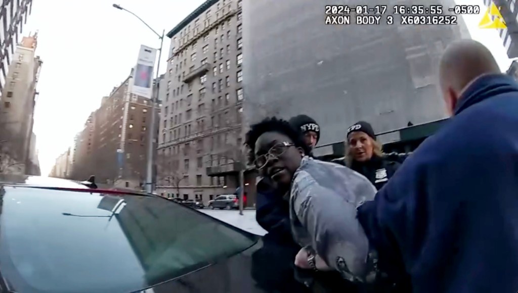 Officers cuff Sahara Dula seconds after she struck one of their own on the Upper East Side.