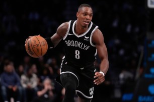 Brooklyn Nets' Lonnie Walker IV looks to pass during the first half of an NBA basketball game against the Memphis Grizzlies, Monday, March 4, 2024, in New York.