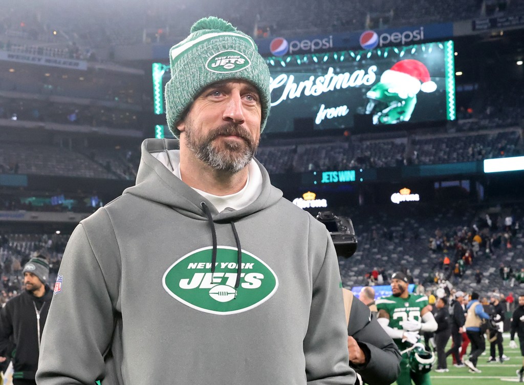 New York Jets quarterback Aaron Rodgers #8, on the field after the Jets beat Washington 30-28.
