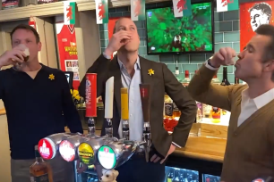 Prince William appeared unbothered as he downed shots of whiskey and pints of beer.