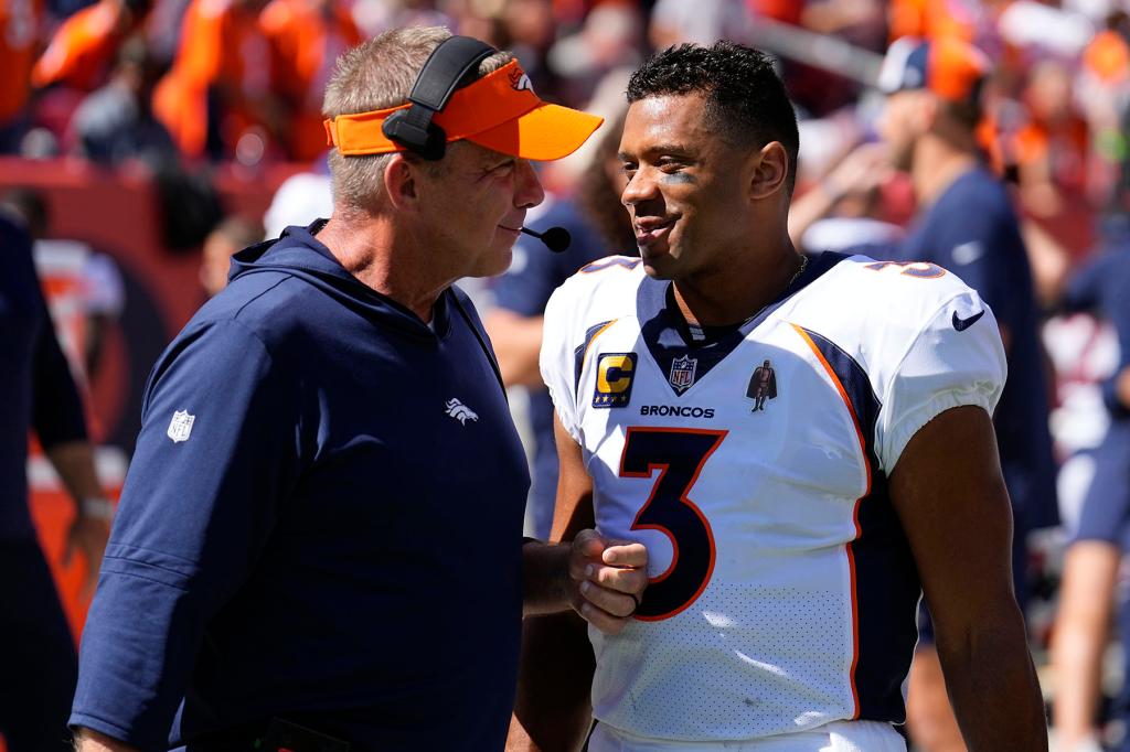 Denver Broncos head coach Sean Payton talks with quarterback Russell Wilson (3) in the first half of an NFL football game against the Washington Commanders, Sunday, Sept. 17, 2023, in Denver. 