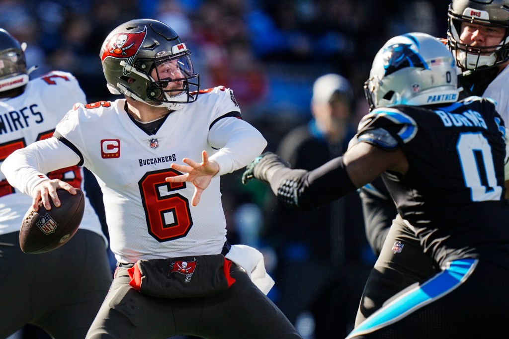 Brian Burns (0) pursues Buccaneers quarterback Baker Mayfield (6).