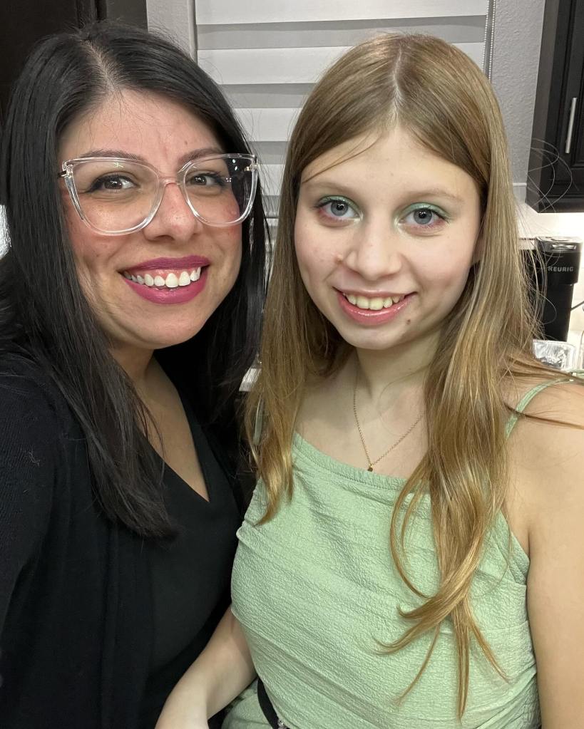 Blond-haired teen Madeline Soto smiles as poses with her mother, Jennifer Soto.