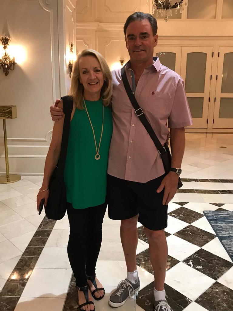 Peter Alan Bush and Lynne Emanuel standing together in a room, owners of the multi-million dollar property accidentally burned down by a real estate agent