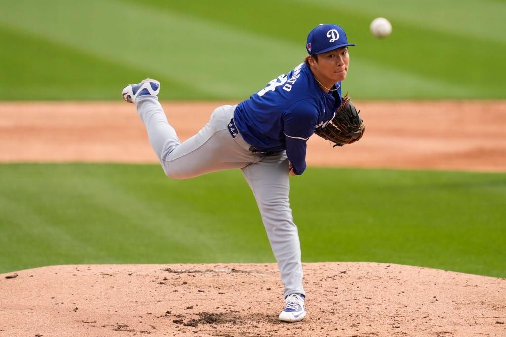 Los Angeles Dodgers starting pitcher Yoshinobu Yamamoto throws during the second inning of a spring training baseball game against the Chicago White Sox in Phoenix, Wednesday, March 6, 2024. 