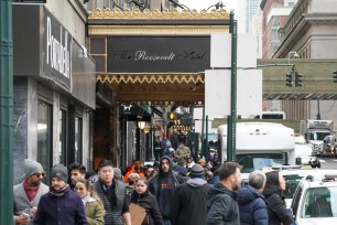 Migrants awaiting to enter The Roosevelt Hotel.