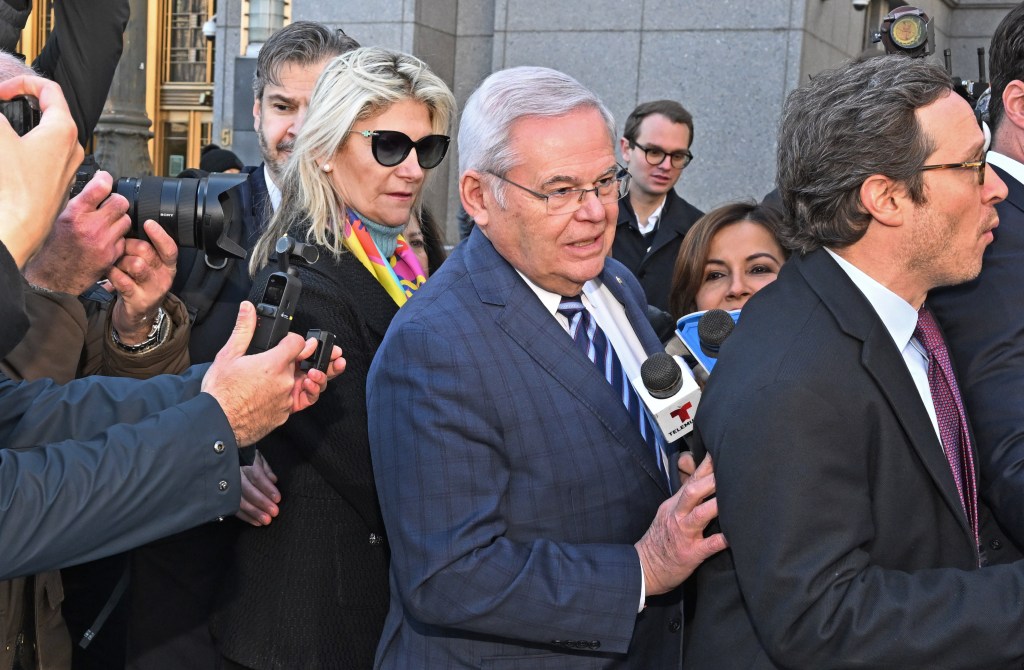 Senator Bob Menendez and his wife Nadine (pictured) leave federal court after being charged .