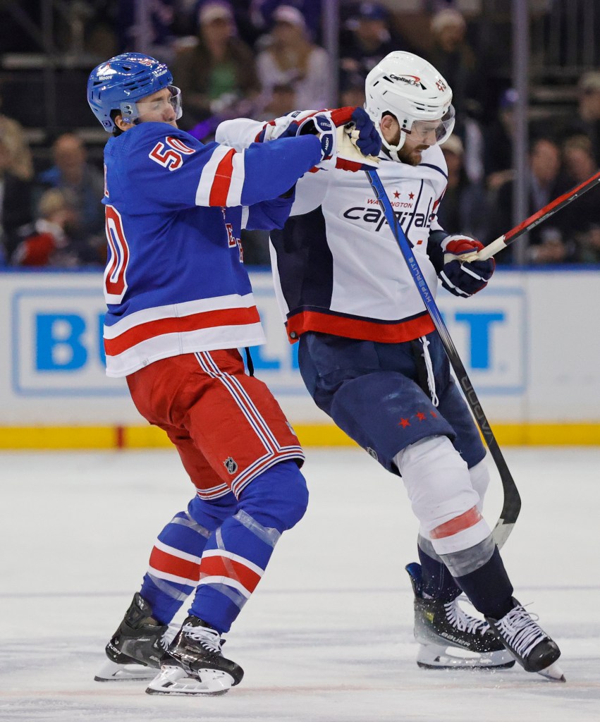 New York Rangers left wing Will Cuylle checks Washington Capitals right wing Tom Wilson during the second period.