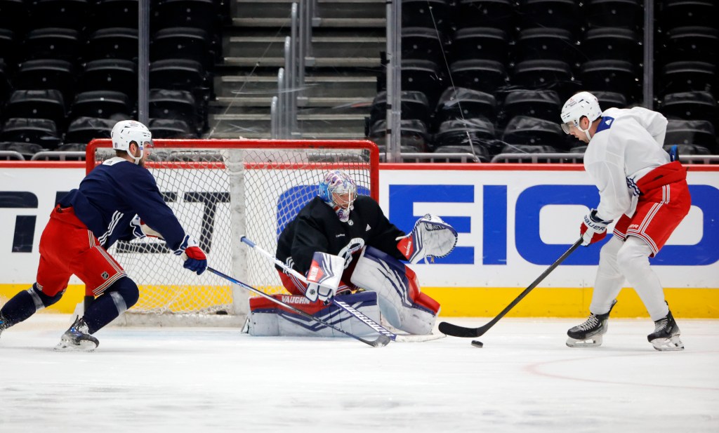 Rangers Filip Chytil is seen shooting a puck on teammate Johnathan Quick during a optional morning skate at Capital One Arena in Washington, DC on Saturday.