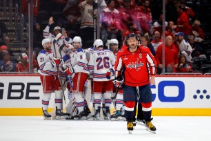 Alex Ovechkin skates off as the Rangers celebrate their sweep over the Capitals on April 28, 2024.