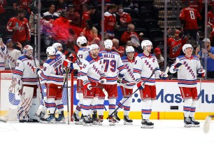 The Rangers celebrate their sweep of the Capitals on Sunday.