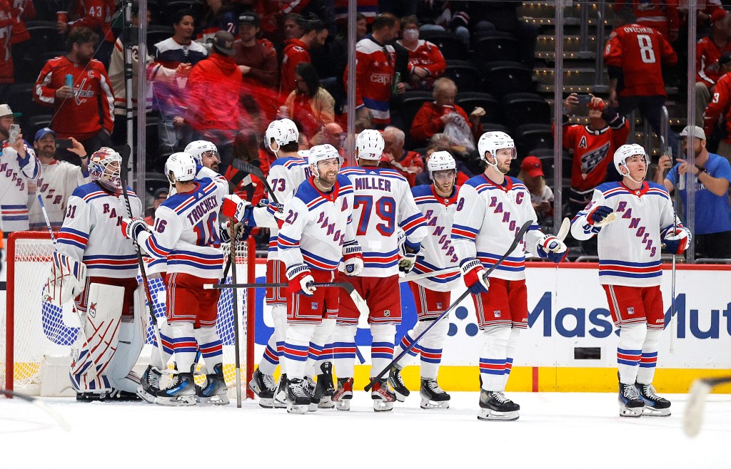 The Rangers celebrate their sweep of the Capitals on Sunday.