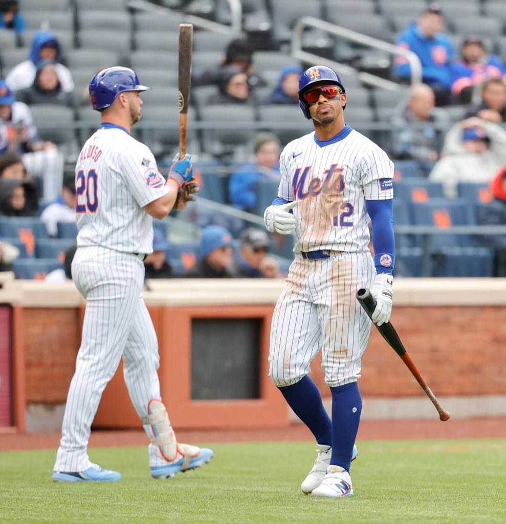 New York Mets shortstop Francisco Lindor walks back to the dugout after striking out during the 9th inning of game one of a doubleheader at Citi Field