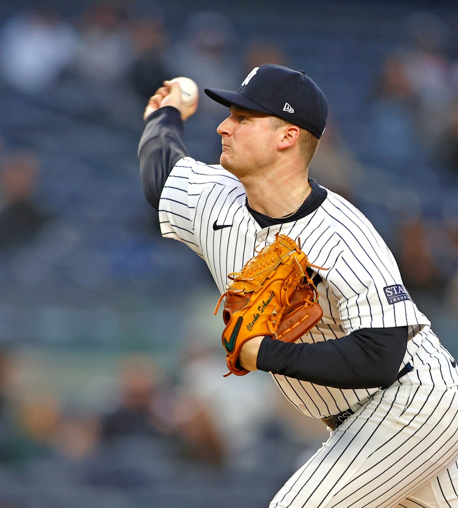 New York Yankees pitcher Clarke Schmidt (36) throws against the Tampa Bay Rays during the 1st inning of baseball game at Yankee Stadium.