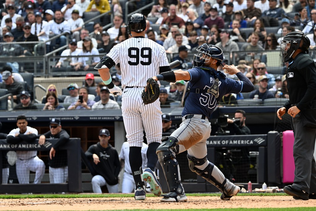 Yankees outfielder Aaron Judge (99) walks back to the dugout after striking out in the fourth inning against the Tampa Bay Rays. Photo by Bill Kostroun. Yankees and Tampa Bay Rays at Yankee Stadium.