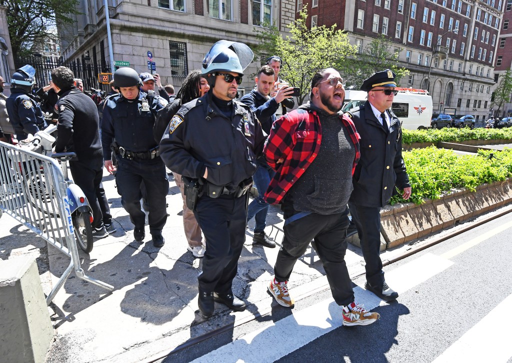 Protesters from both sides gather outside of Columbia University as students to occupy the campus.