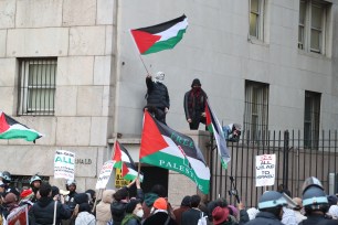 Anti-Israel protestors waving Palestinian flags at Columbia University in Manhattan on April 22, 2024.