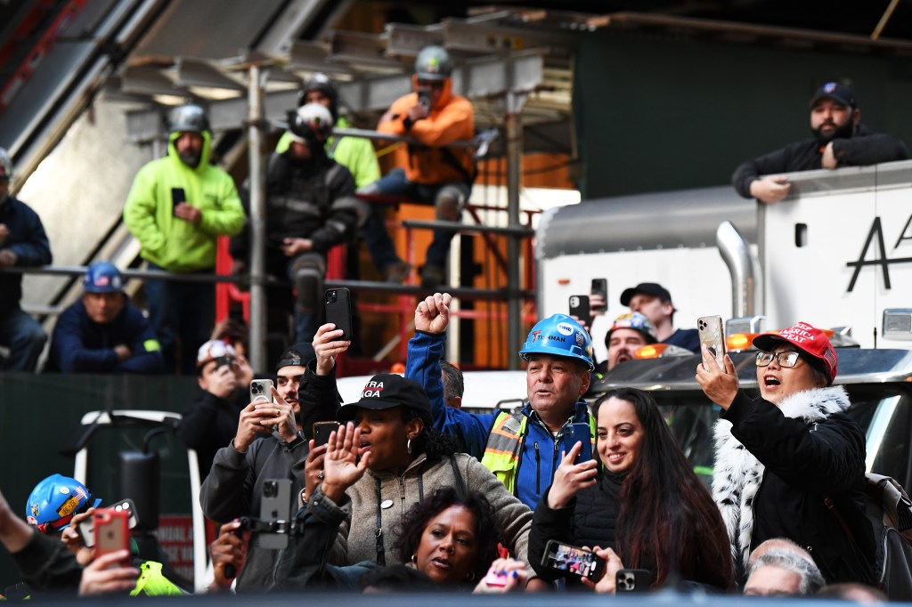 Supporters cheers outside the construction site of the new J.P. Morgan Chase building.