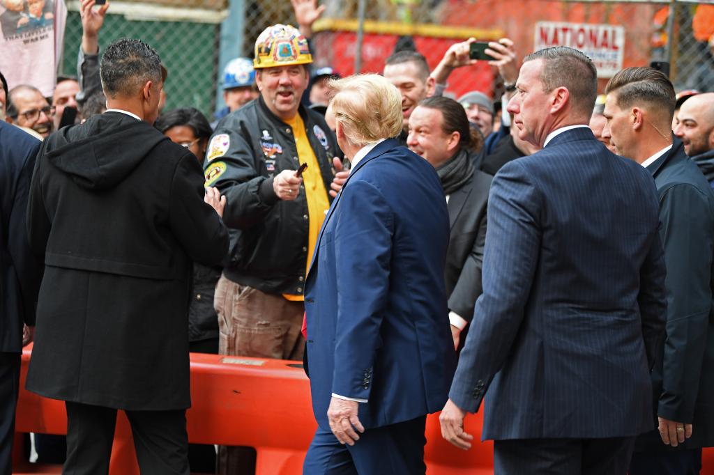 Trump greets union workers.