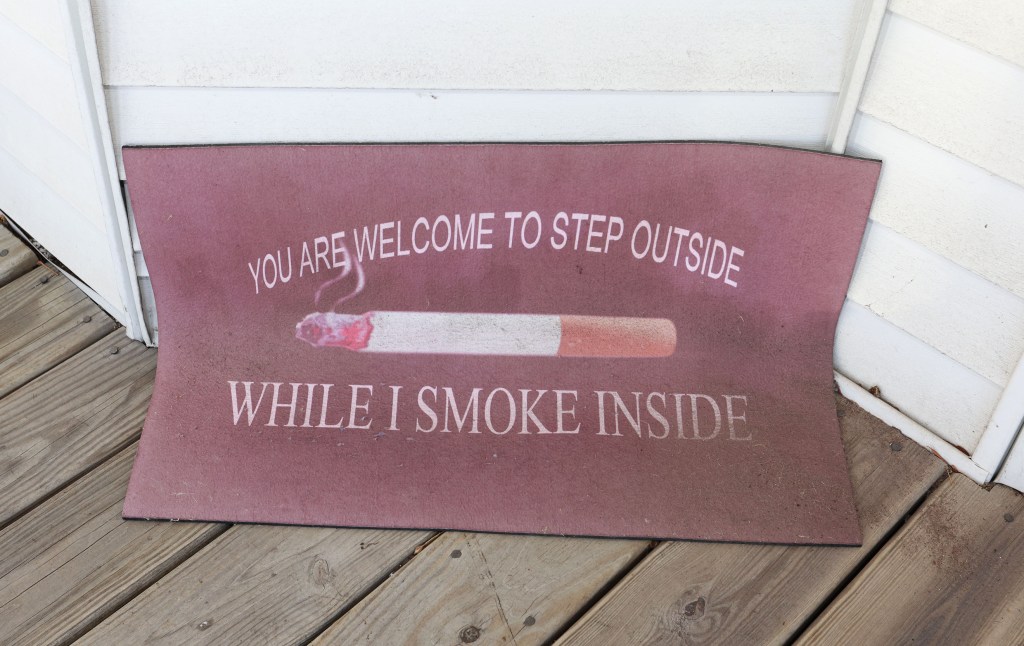 The doormat outside Silk's Marine Park home. For her the fight for smokers' rights is a fight for personal liberties