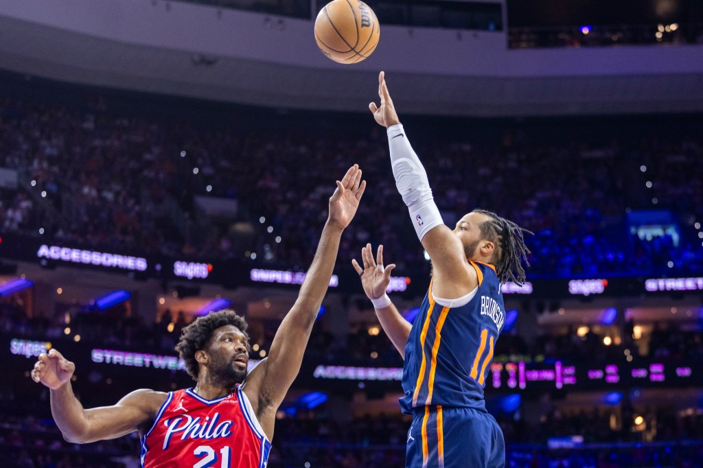 Jalen Brunson shoots a floater over Joel Embiid on Sunday.