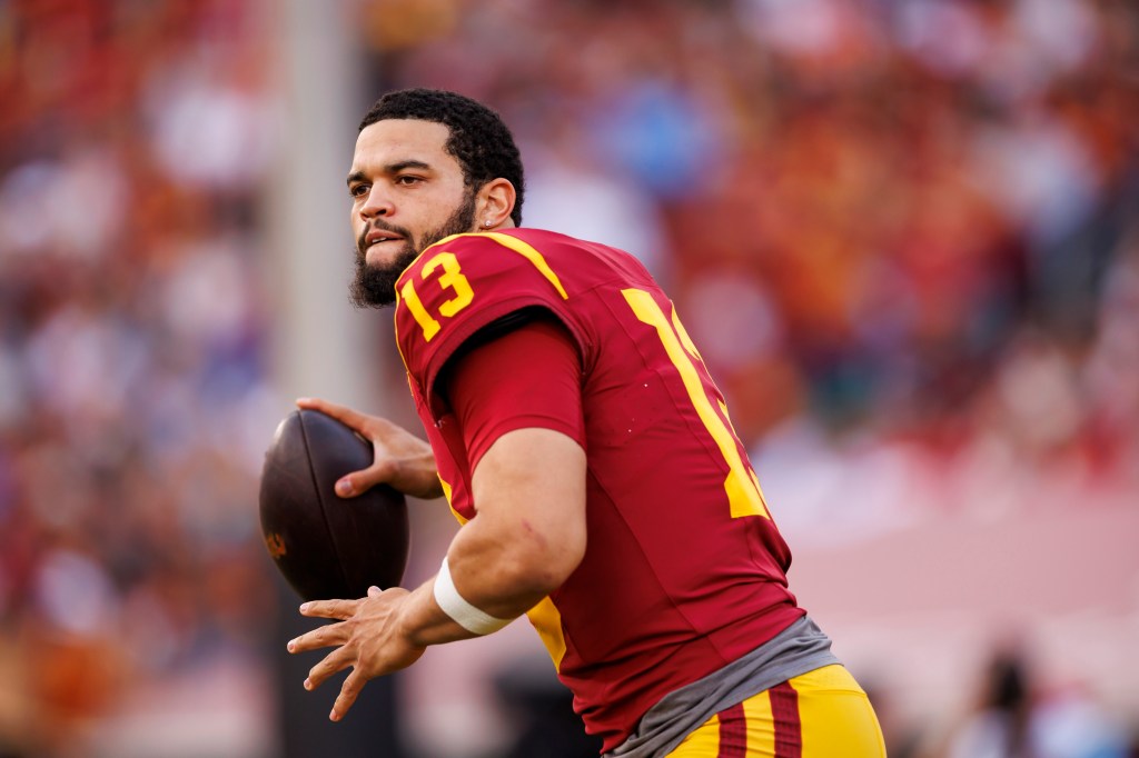 Caleb Williams #13 of the USC Trojans looks to throw a pass on the sideline
