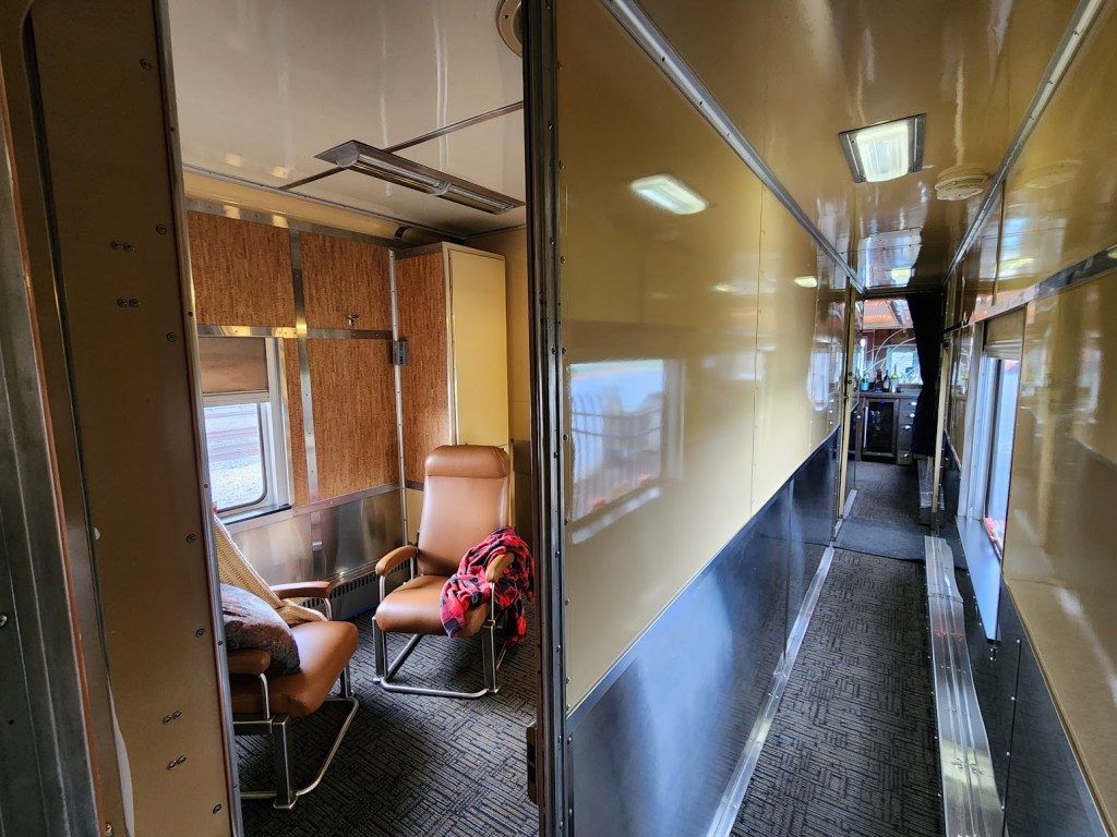 A photo of  a Blue Ridge Club train car master suite and hall to lounge.