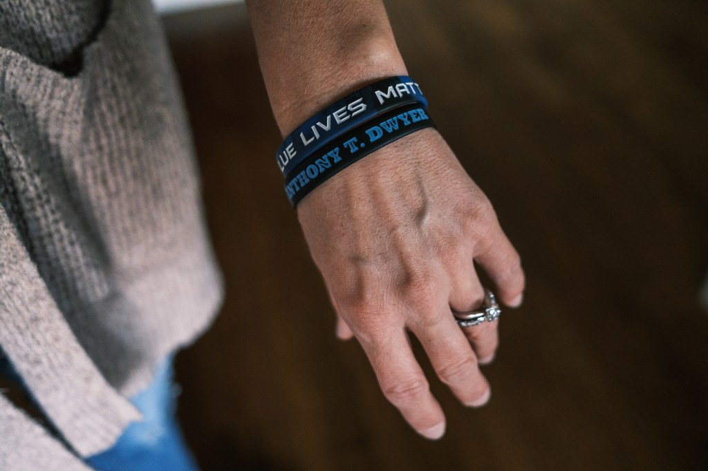 A photo of a loved one wearing Blue Lives Matter and Anthony T Dwyer wristbands in memory of the fallen NYPD officer.