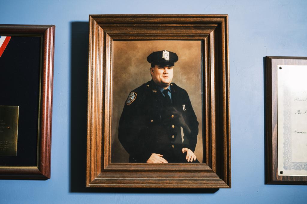 A framed photo of NYPD officer Anthony Dwyer hangs on the wall of his mother Marge's home.