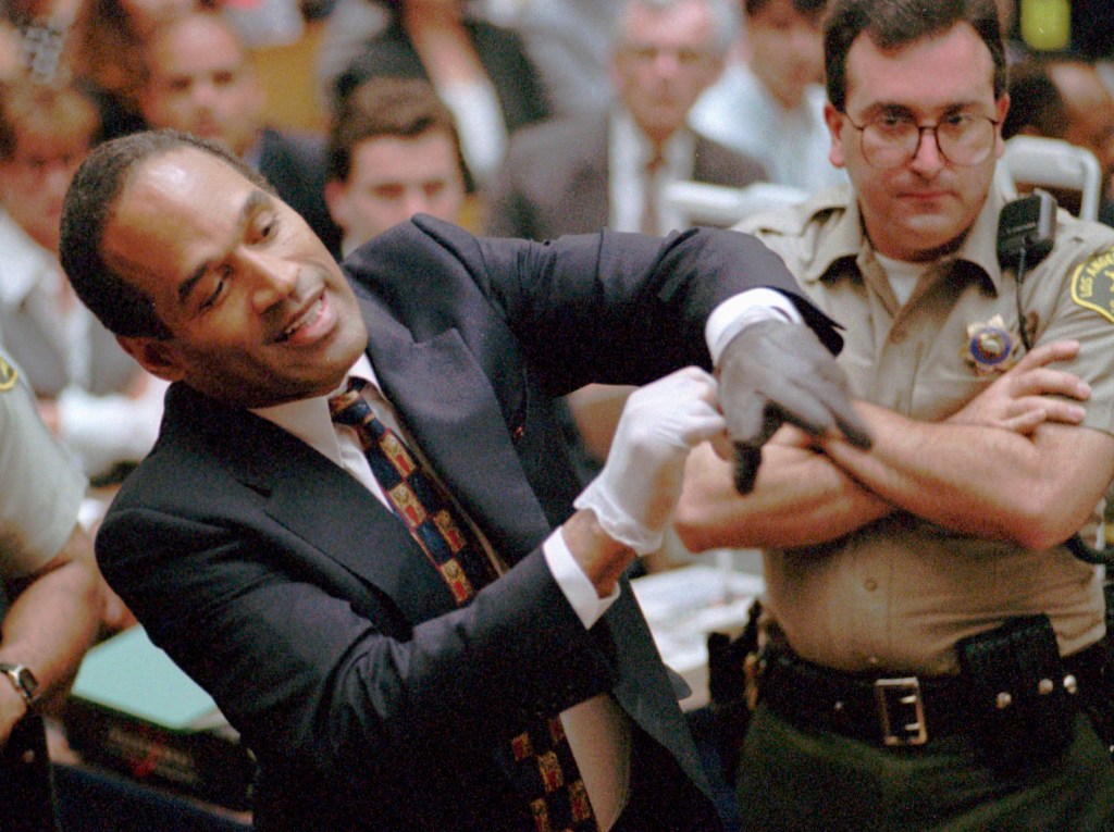 OJ trying on the glove in court. 