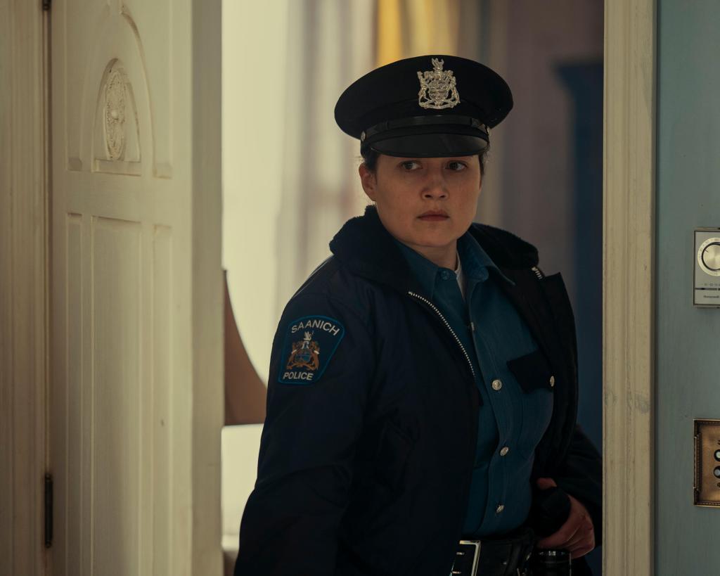 Lily Gladstone in a cop outfit. 