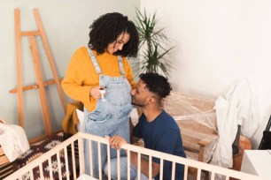 Happy multiracial couple expecting a baby