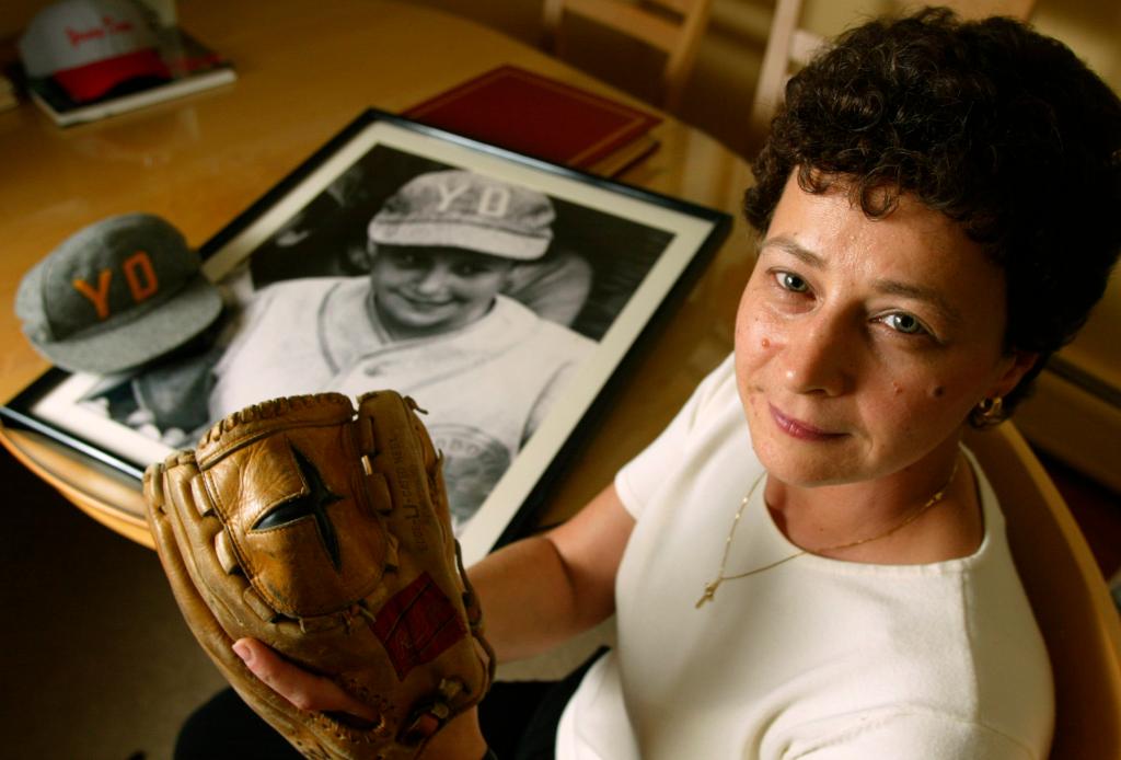 Maria Pepe with her Little League hat and glove.