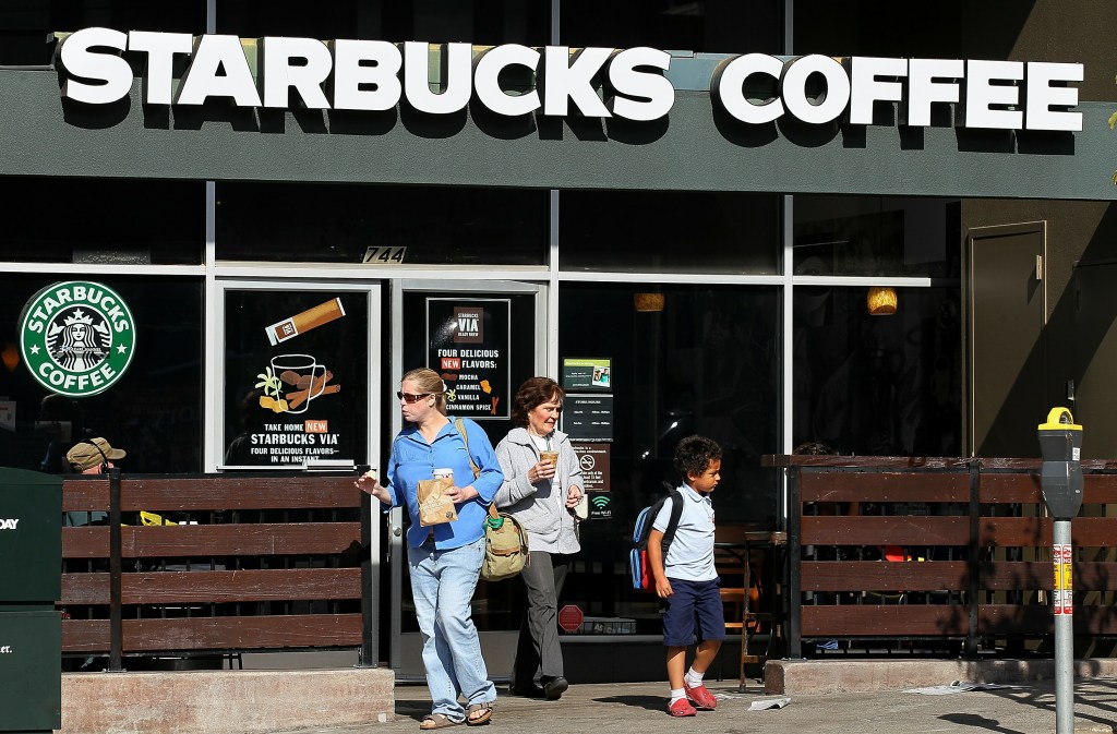 Customers leave a Starbucks Coffee store on November 4, 2010 in San Francisco, California