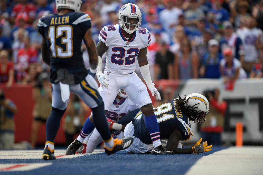 Bills' Vontae Davis, center, gets up after Los Angeles Chargers' Mike Williams, right, scores a touchdown