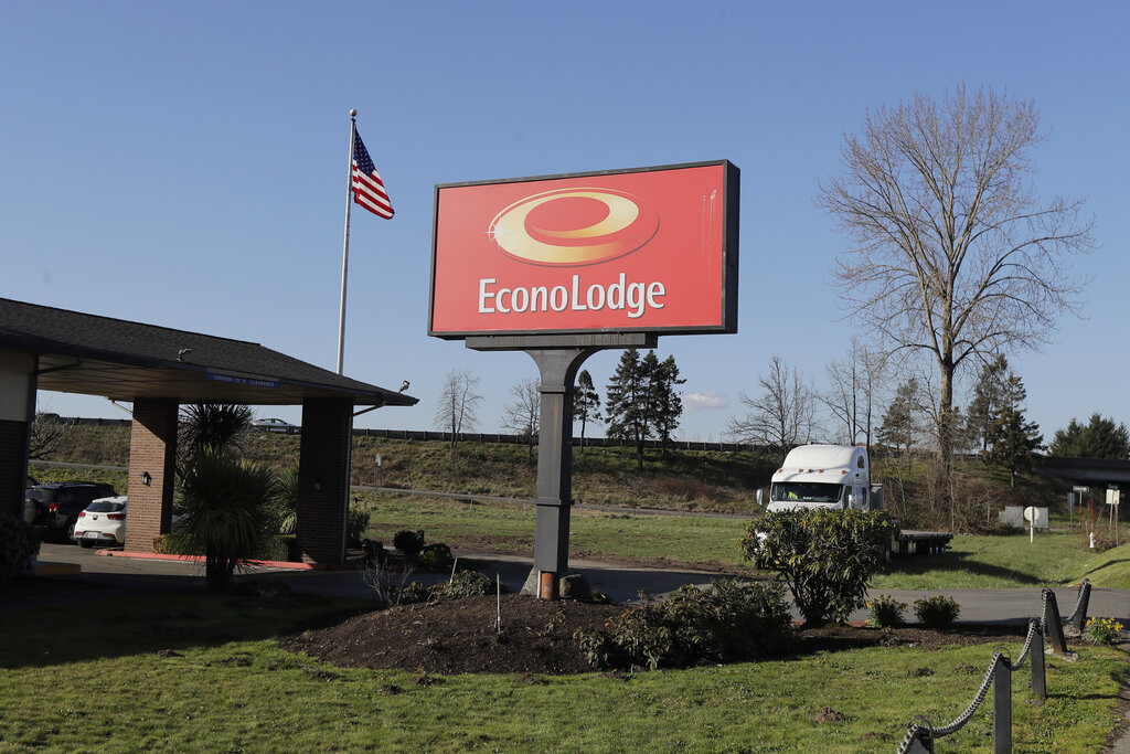 U.S. flag flying near the entrance of an Econo Lodge motel in Kent, Washington, purchased for COVID-19 patient recovery and isolation