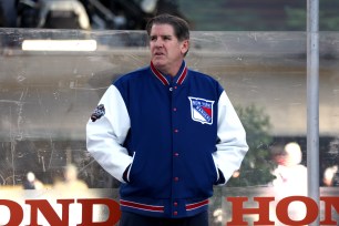 Head Coach Peter Laviolette of the New York Rangers looks on from behind the bench before the 2024 Navy Federal Credit Union Stadium Series game between the New York Rangers and the New York Islanders at MetLife Stadium on February 18, 2024 in East Rutherford, New Jersey.