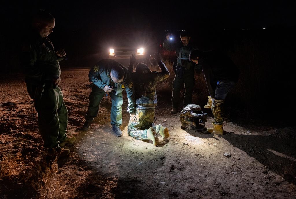 Mexican immigrants captured by U.S. Border Patrol agents are searched while being taken into custody near the U.S.-Mexico border on November 03, 2022 near Douglas, Arizona