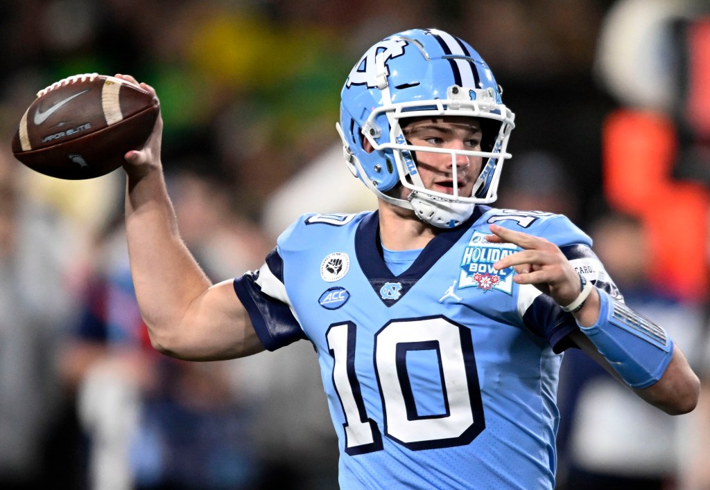 North Carolina quarterback Drake Maye in a football uniform getting ready to pass the ball during the Holiday Bowl NCAA college football game