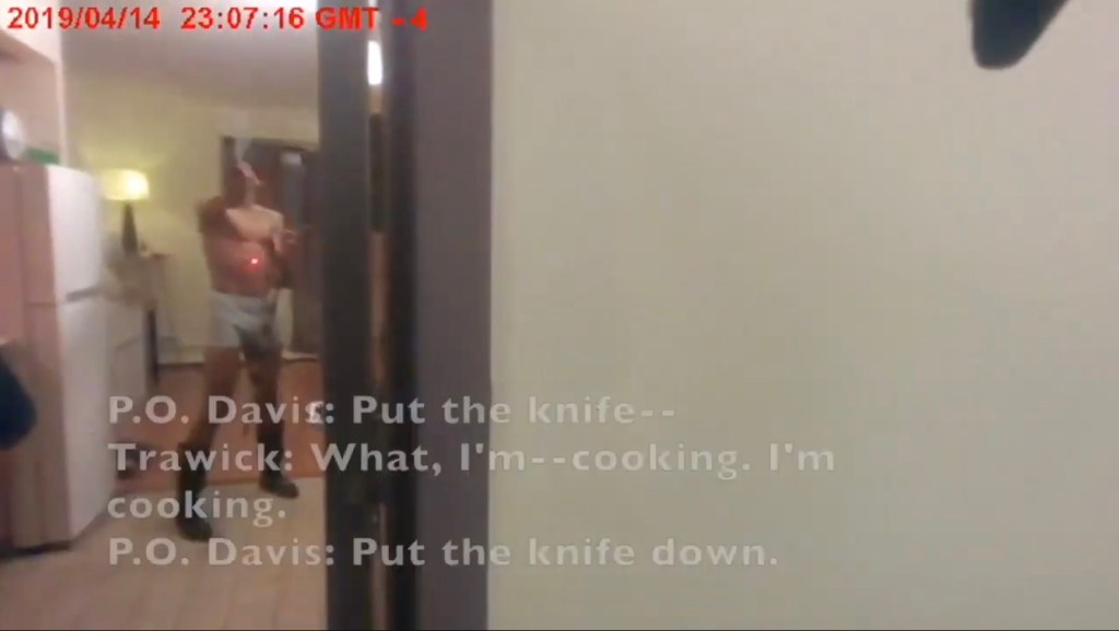 Footage from the police officers' body worn cameras shows him standing in front of the cops with a knife.