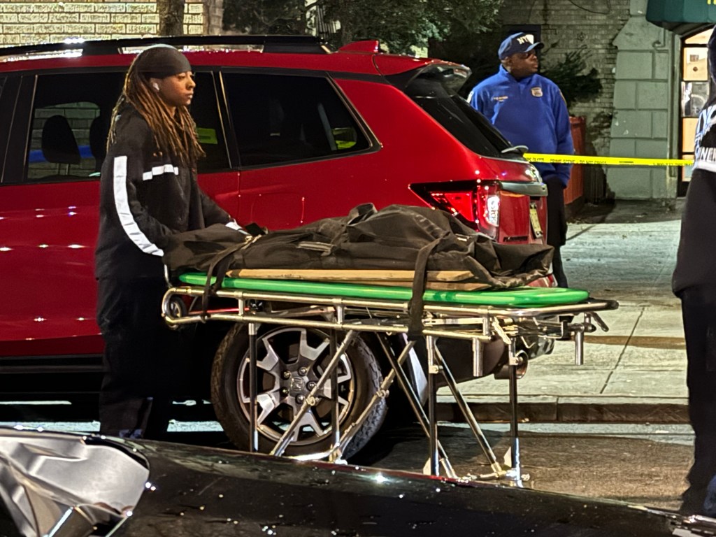 The body of a child is removed from 240 East 175th Street near Weeks Avenue in Mount Hope, Bronx, Dec. 18, 2023.  Gloria Asamoah, 42, has been indicted for the murder of her twins George and Gianna Kantanka.