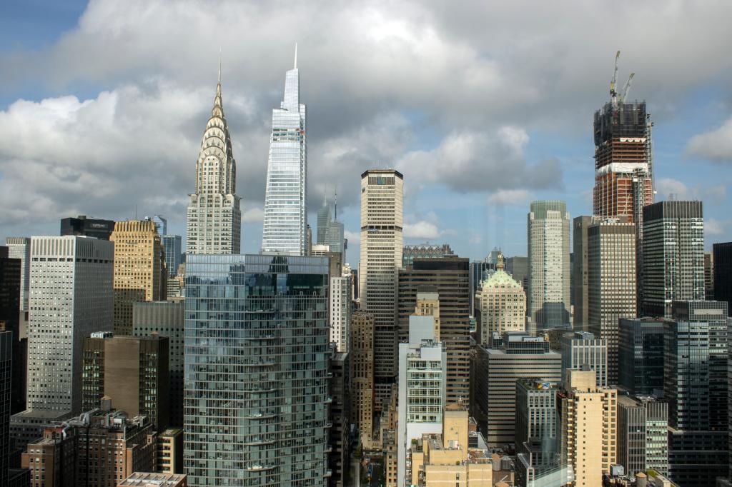 Manhattan's skyline can be seen under a cloudy sky