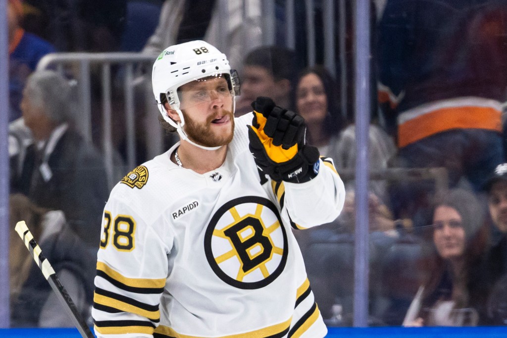 Boston Bruins right wing David Pastrnak (88) scores off New York Islanders goaltender Ilya Sorokin (30) for the win during the overtime shootout at UBS Arena, Friday, Dec. 15, 2023